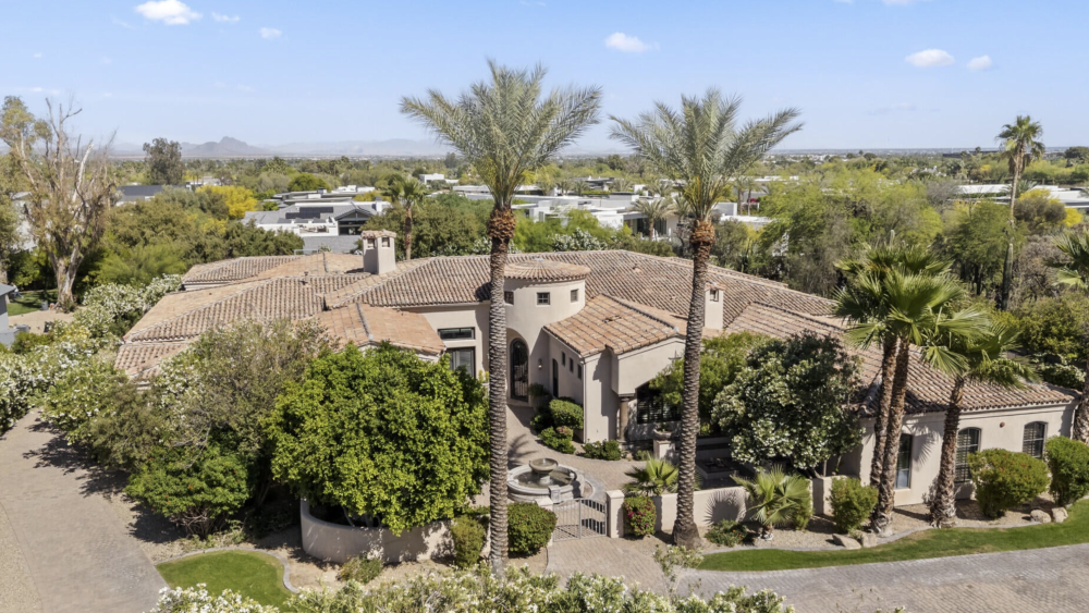 Millionaires Moving to Arizona live in beautiful homes such as this one with lush landscaping and desert views